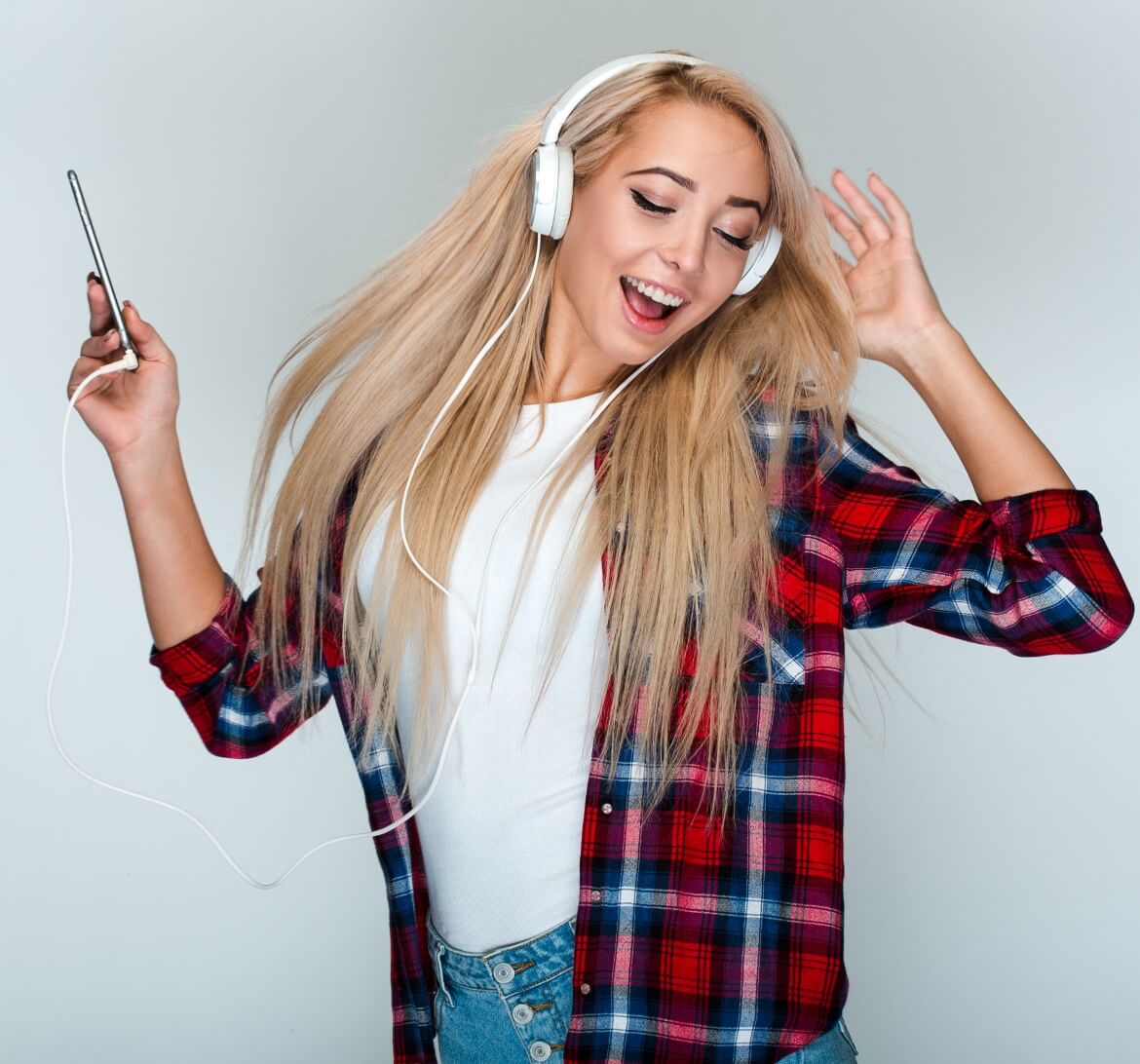 A young woman grooving to some tunes.