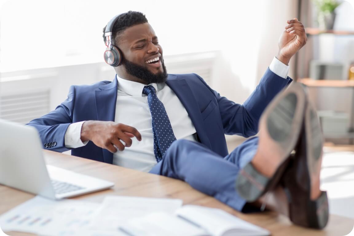 A young business man grooving out.