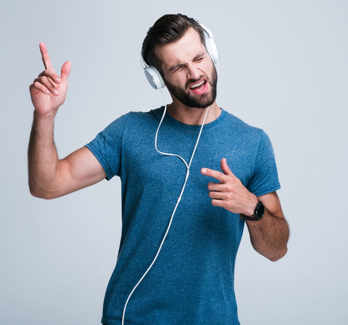 A young man grooving to some tunes